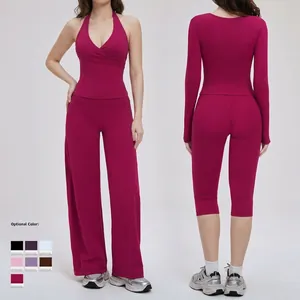 Rose red three-piece yoga set featuring halter top, long sleeve shirt and wide leg pants