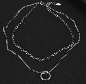 Detail of silver layered necklace with lobster clasp and adjustable metal chain extension