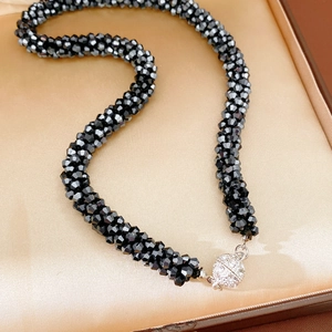 Elegant magnetic necklace with black faceted glass beads and a sparkling diamond-set clasp