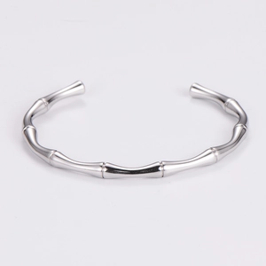 Detailed view of polished stainless steel bamboo joint cuff bracelet with mirror finish