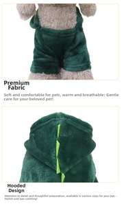 Detail of plush dinosaur pet hoodie fabric and hood with triangular scale accents
