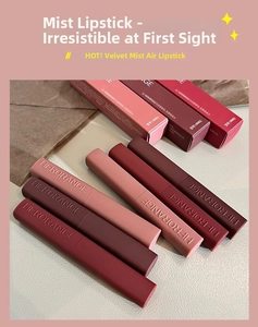 Flat lay of velvet matte lipstick tubes and boxes in shades of brick red and dusty rose