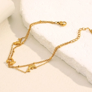 Detail of 18K gold-plated double-layer dolphin anklet with lobster clasp and adjustable chain