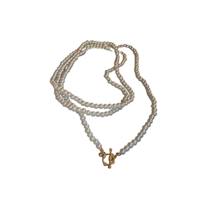 French vintage multilayer pearl necklace with gold OT buckle on white background