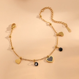 Bracelet en acier inoxydable doré avec pendentifs cœur et perles en émail noir chic