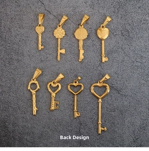 Detailed set of eight vintage gold titanium steel heart key pendants showing ornate patterns