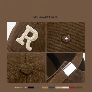 Dark brown corduroy baseball cap with beige R letter embroidery and adjustable metal buckle