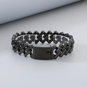 Close-up of 20mm black stainless steel Cuban link bracelet with a secure folding clasp