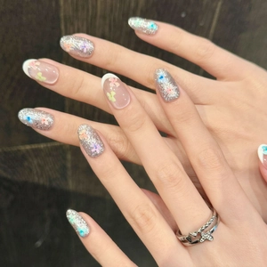 Floral cat eye press-on nails with silver glitter, French tips, and colorful flower accents