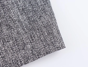 Macro shot of grey herringbone fabric texture and woven patterns for blazer suits