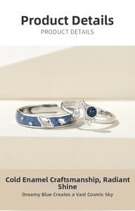 Detail of S925 silver couple rings featuring astronaut and cold enamel starry sky design