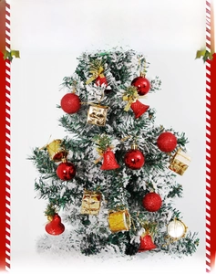 Detail of red festive ornaments and golden gift boxes on snowy Christmas tree branches