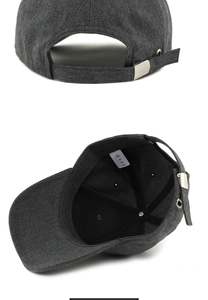 Detail of dark grey cotton baseball cap showing adjustable metal buckle and breathable holes