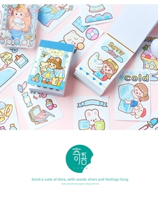 Flat lay of colorful cartoon memo pads and themed stickers for DIY scrapbooking decor