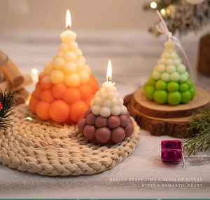 Detailed close-up of bubble gradient Christmas tree scented candles for home decor