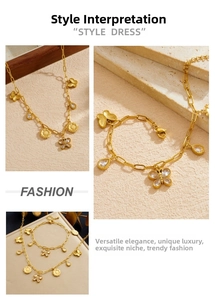 Detail of gold butterfly and sunflower pendant necklace set with crystal charms