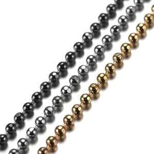 Detailed macro view of metal ball chains in black, silver and gold finishes for DIY jewelry