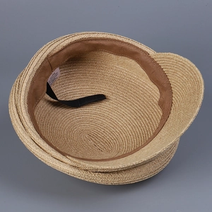 Elegant natural straw boater hat for women featuring adjustable inner strap and sweatband