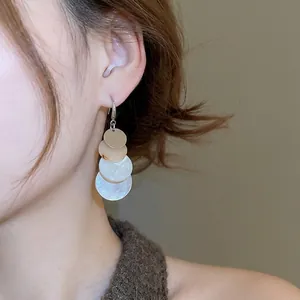 Elegant multi-layer geometric circle drop earrings with gold and resin tassels for women