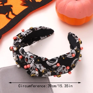 Detail of Halloween knotted headband with skull pattern and beaded rhinestones