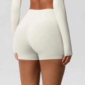 Close-up of high-waist yoga shorts showing the push-up effect and seamless white fabric