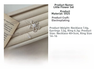 Close-up of S925 silver flower jewelry set with necklace, earrings and ring on velvet