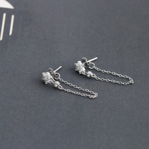 Detail shot of the S925 silver earring showing the tassel chain and hallmark 925 engraving
