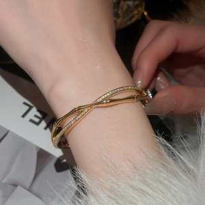 Detail of 18k gold-plated bamboo-style bangle with sparkling pavé cubic zirconia