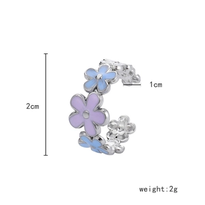 Detailed view showing 2cm height and 2g weight of floral enamel adjustable ring