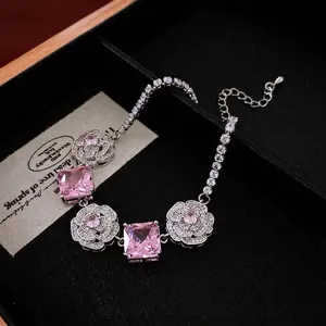 Pink gemstone bracelet with silver camellia flowers and sparkling zircon tennis chain
