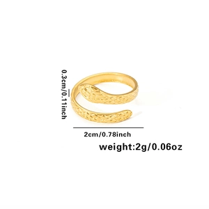 Detail showing 0.3cm width and 2cm diameter measurements of gold snake ring