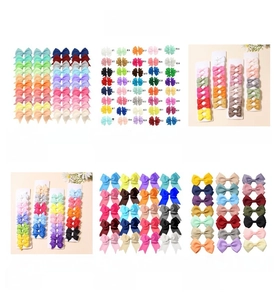 Detail of colorful grosgrain ribbon bow hair clips set for kids shown in multiple styles