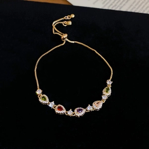 Detail of pear-cut colorful zircon bracelet with adjustable slider and gold finish