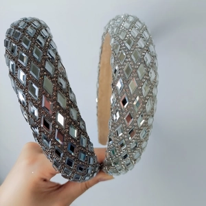 Close-up of thick rhinestones headbands in silver and grey featuring sparkling crystals