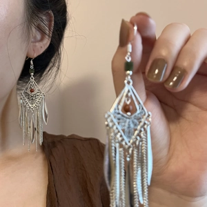 Bohemian silver earrings with butterfly diamond charm and long chain tassels in green