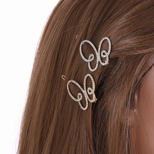 Elegant butterfly hair clips with shimmering rhinestones in gold and silver finish