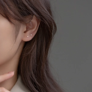 Minimalist 999 sterling silver stud earrings with tiny pink and clear cubic zirconia stones