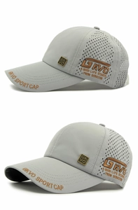 Detail of grey sport cap showing laser-cut mesh holes and side embroidery for breathability