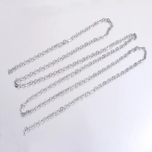 Polished silver stainless steel 4mm flat cross chain necklace in a coiled display