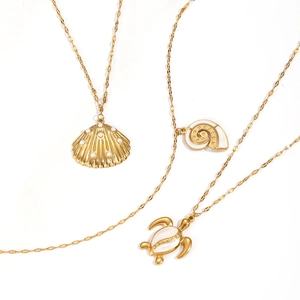 Gold stainless steel ocean series necklaces with shell, nautilus, and turtle pendants