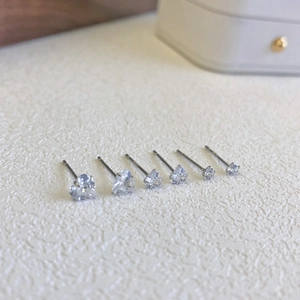 Macro shot of three pairs of S925 sterling silver heart-shaped cubic zirconia studs