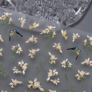 Embossed nail stickers featuring white flowers and blue kingfisher birds with 3D texture