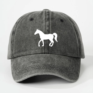 Close-up of washed black baseball cap featuring a white horse silhouette and stitch detail