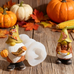 Detailed harvest gnome silicone mold with finished pumpkin and autumn maple leaf decor