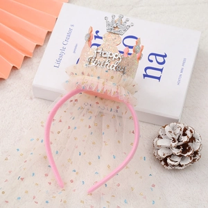 Detail of pink birthday crown headband with silver Happy Birthday text and sequins veil