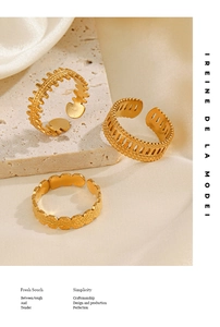 Detailed close-up of three gold stainless steel rings with unique geometric textures