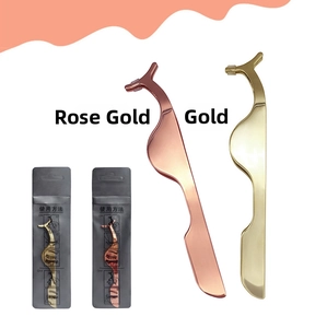 Detail of rose gold and gold eyelash applicators with manual instructions on packaging