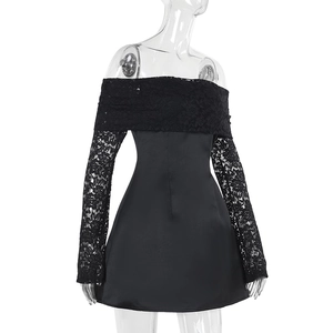 Detail eines eleganten schwarzen schulterfreien Kleides mit Spitze und glattem Satin-Stoff