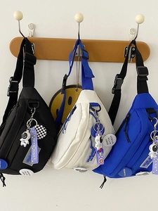 Harajuku style nylon crossbody bags in black, white, and blue with astronaut charms