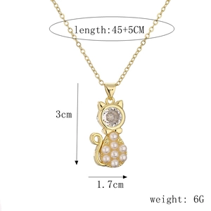 Detailed view of cat pendant with pearl and rhinestone including size and weight specs